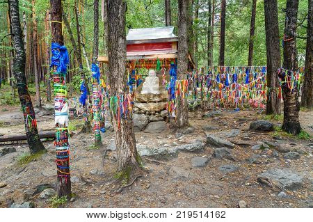 Statue Sagaan Ubgen White Old Man is near Source of mineral water in Arshan. Buryatia. Russia