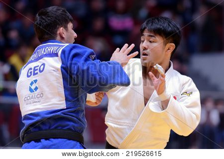 ST. PETERSBURG, RUSSIA - DECEMBER 16, 2017: Final fight Soichi Hashimoto, Japan (white) vs Lasha Shavdatuashvili, Georgia during Judo World Masters tour. Hashimoto won gold medal