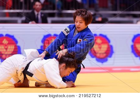 ST. PETERSBURG, RUSSIA - DECEMBER 16, 2017: Final fight Sumiya Dorjsuren, Mongolia (white) vs Tsukasa Yoshida, Japan during Judo World Masters tour. Dorjsuren won gold medal