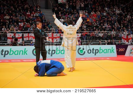 ST. PETERSBURG, RUSSIA - DECEMBER 17, 2017: Final fight Khasan Khalmurzaev (white) vs Aslan Lappinagov, both of Russia during Judo World Masters tour. Khalmurzaev won gold medal