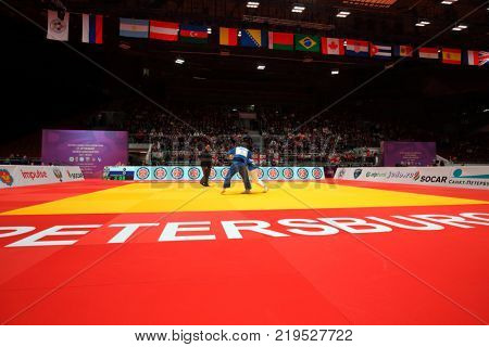 ST. PETERSBURG, RUSSIA - DECEMBER 17, 2017: Final fight Beka Gviniashvili, Georgia (blue) vs DongHan Gwak, Korea during Judo World Masters tour. Gviniashvili won gold medal