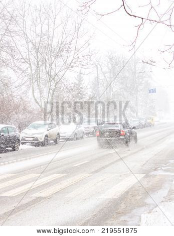 snowstorm, poor visibility, slick roads and little of traffic