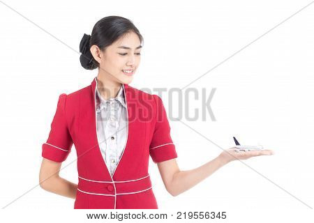 Portrait Of Asian Air Hostess Holding Airplane Model With White Background, Woman Stand And Smile At