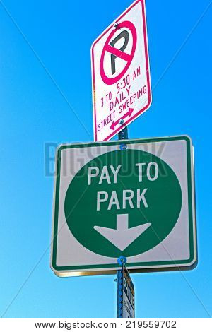 Pay to park sign in a city