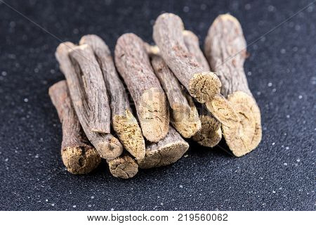 Pile Of Licorice Root On A Black Background