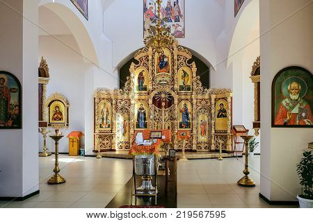 Belgorod Russia - May 20 2017: Font with a pulpit an iconostasis and altar of the Russian Orthodox Church. Interior of the cathedral's hall in honor of the icon of the Mother of God "Softening of Evil Hearts" called still in the people "Seven-Stall".