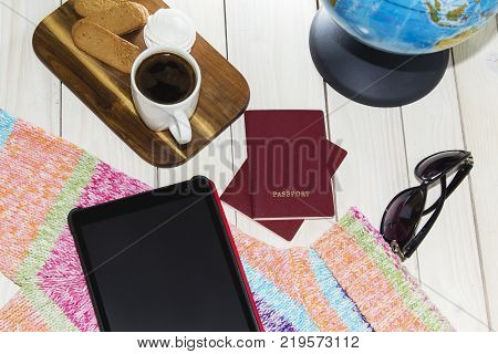 Concept photo of tourist planing the trip with map, passport, mobile phone