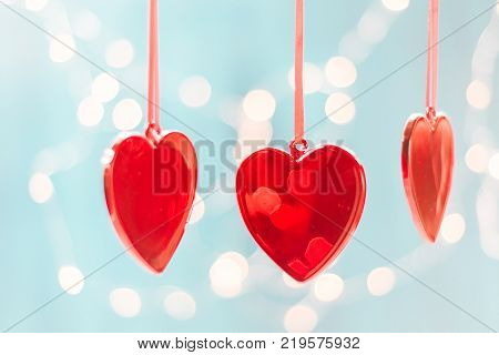 Two red hearts of ribbon. Valentines day greeting card.
