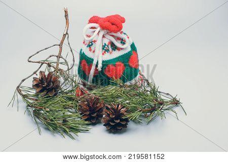 Christmas Santa Сlaus gift bag and pine cones on a a white background