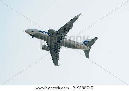 Tyumen, Russia - August 11, 2012: On a visit at UTair airshow in heliport Plehanovo. Flying Boeing 737-524 of Utair company