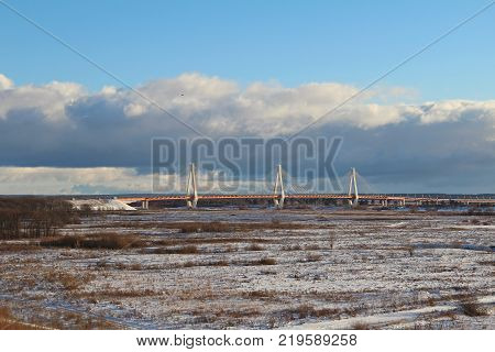 Autumn landscape with a view of the cable-stayed bridge on the river Oka Murom Russia.