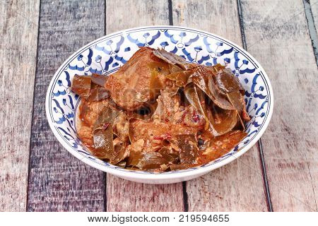 Traditional Thai herb recipeCurry pork with Chamuang (Garcinia cowa) leavesLocal Thai food call as Gang moo cha muang.