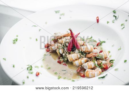 fresh mediterranean prawns in white wine garlic and chilli sauce tapas dish
