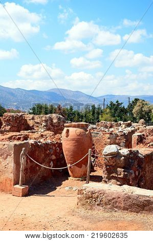MALIA, CRETE - SEPTEMBER 14, 2016 - Ancient large decorated terracotta pot within the walls of the Minoan Malia ruins archaeological site Malia Crete Greece Europe, September 14, 2016.