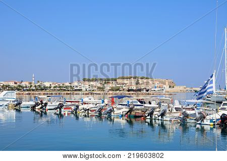 RETHYMNO, CRETE - SEPTEMBER 15, 2016 - View of boats moored in the harbour with the castle to the rear Rethymno Crete Greece Europe, September 15, 2016.