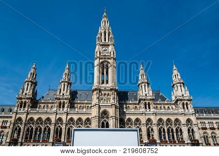 Vienna,  Austria - August 16, 2017: Rathaus building in Vienna. It is the the town hall of the city. Low angle view against blue sky