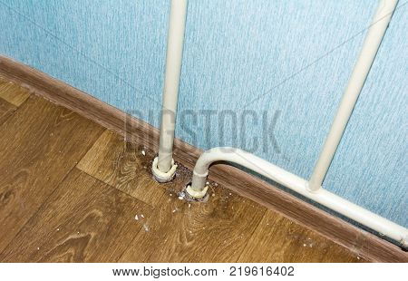Poorly executed repairs. Water riser with defects. Close-up.