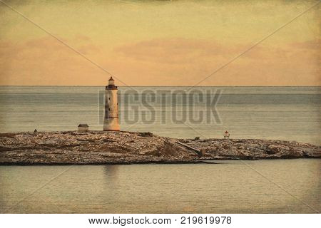 Sea view to the small Torungen lighthouse a cold colorful winter evening