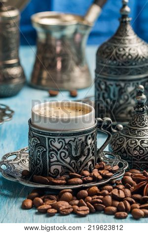 Turkish coffee and turkish delight with traditional embossed metal tray and cup