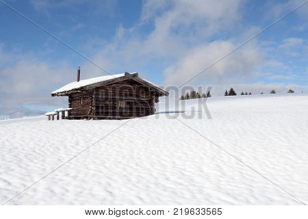 South Tirol Snow Landscape And Wooden Cabin