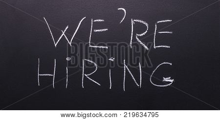 We're hiring is the concept of a poster for hiring staff.