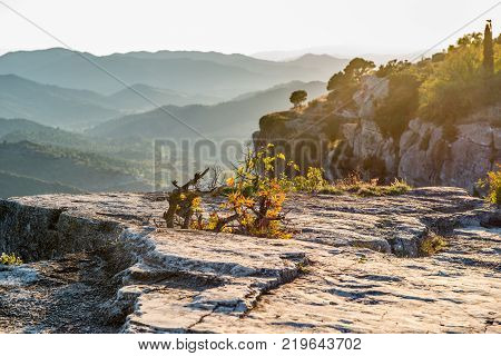 Stone Close-up Against A Background Of Mountains In The Fog Tarragona, Spain. Copy Space For Text