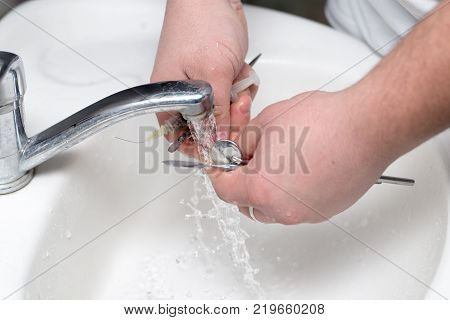 dentist washes tools in dentistry . Photos in the studio