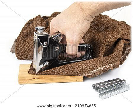 Heavy duty staple gun with staples on the white background