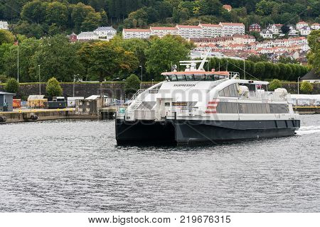 BERGEN, NORWAY - 22 SEPTEMBER, 2017: Norled express passenger ferry leaves Bergen harbor