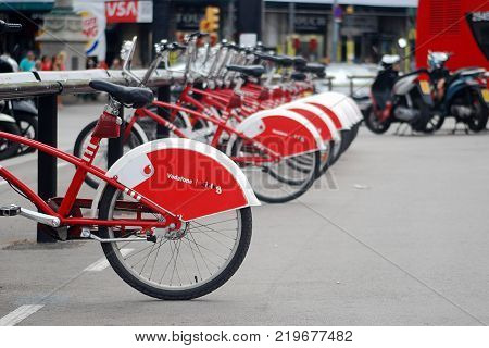 BARCELONA, SPAIN - August, 2014: Vodafone Bicing, public bicycles service at Barcelona. Vodafone Bicing is a bicycle sharing system inaugurated on March 22, 2007.