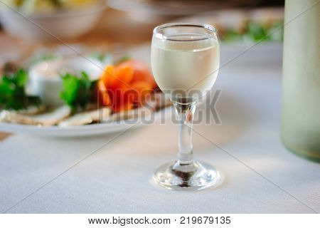 Russian vodka in glass on holiday table
