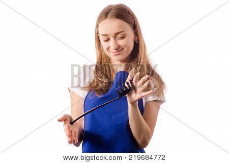 Young woman in apron holding spaghetti spatula on a white background isolation