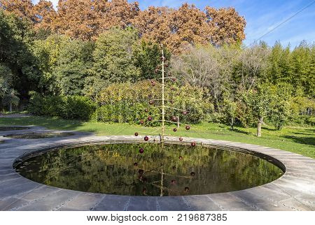 Decorated Christmas tree in the pond in Botanical Garden (Jardin Botanico-Historico La Concepcion) in Malaga Andalusia Spain