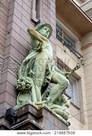 The statue of Commerce. Fragment of the House of the Trading Association The Eliseev Brothers Eliseevsky Shop in Saint Petersburg Russia.