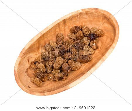 Organic unsulfured dried mulberries in wooden bowl