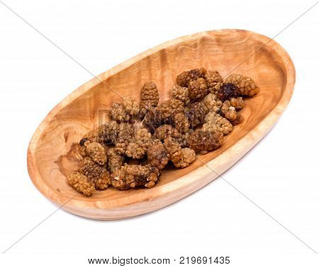 Organic unsulfured dried mulberries in wooden bowl