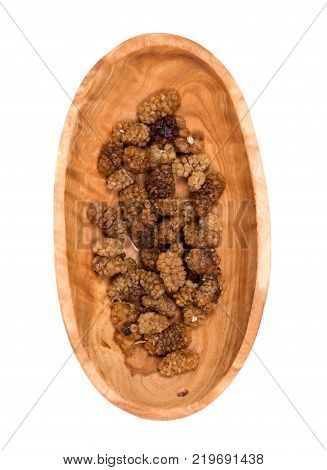 Organic unsulfured dried mulberries in wooden bowl