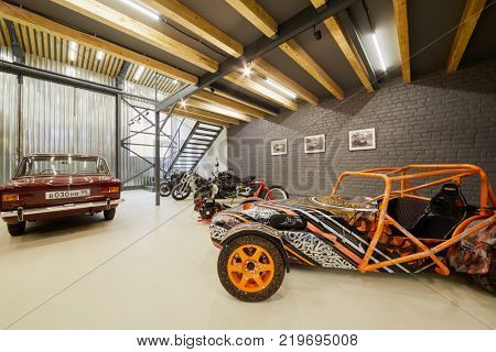 MOSCOW, RUSSIA - OCT 27, 2017: (PR) Racing car based on Lotus Seven and sports motorcycles in garage of DB 527 company producer of russian sports cars.