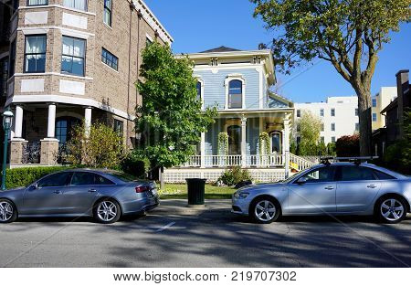 PETOSKEY, MICHIGAN / UNITED STATES - OCTOBER 18, 2017: An elegant blue Victorian home, with a wraparound porch, on Howard Street, near downtown Petoskey.