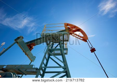 Pumpjack.
A pumpjack is the overground drive for a reciprocating piston pump in an oil well.
The arrangement is commonly used for onshore wells producing little oil. Pumpjacks are common in oil-rich areas.