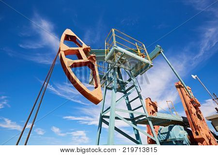 Pumpjack.
A pumpjack is the overground drive for a reciprocating piston pump in an oil well.
The arrangement is commonly used for onshore wells producing little oil. Pumpjacks are common in oil-rich areas.