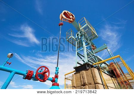 Pumpjack.
A pumpjack is the overground drive for a reciprocating piston pump in an oil well.
The arrangement is commonly used for onshore wells producing little oil. Pumpjacks are common in oil-rich areas.