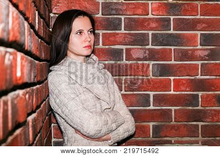 Portrait Of The Young Woman Up To Shoulders At A Wall