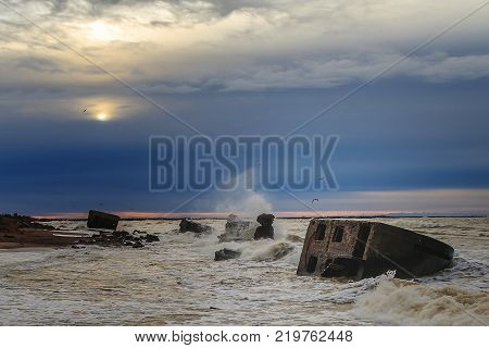 Waves beating against Latvia.Liepaja.Karosta. described the fortress ruins