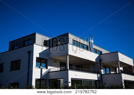 modern multi family house in munich blue sky