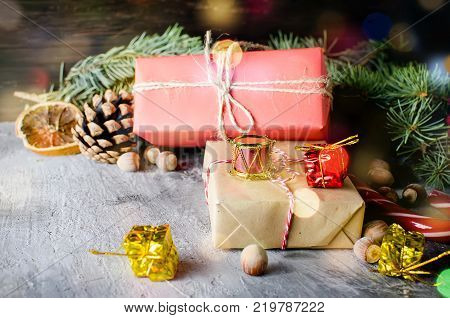 Red Christmas  Gift  Box With Red Ribbon And Fir Branches