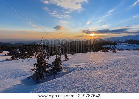 winter sunrise in the Ciucas Mountains Romania