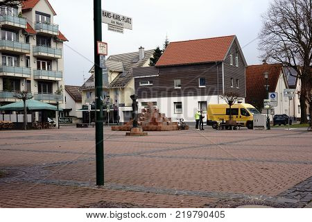 GRIESHEIM, GERMANY - DECEMBER 02: The Hans-Karl-Square, a public square on the market with residential buildings, fountains and sculptures on December 02, 2017 in Griesheim.