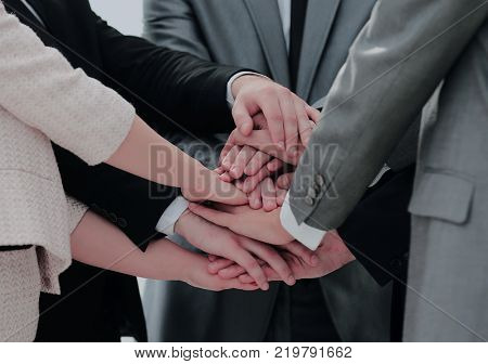 success concept collaboration: a friendly business team put thei