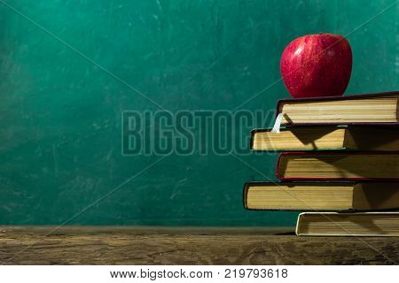 Old books on a wooden table. Beautiful background.